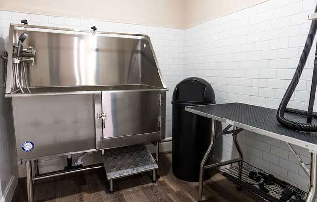 a kitchen with a large stainless steel refrigerator and a table