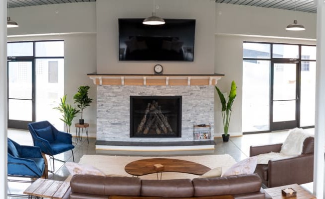 a living room with a fireplace and a pool table at Scott's View, Virginia