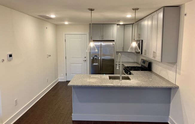 Stunning 2-Bed Condo with Private Roof Deck in Norris Square! Available mid-July!