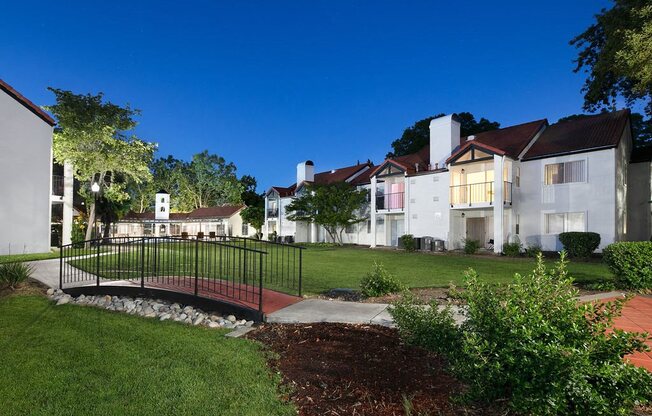 Courtyard with Connecting Bridge, Manicured Grass, and View of Apartments Complex at Laurel Creek, Fairfield, CA