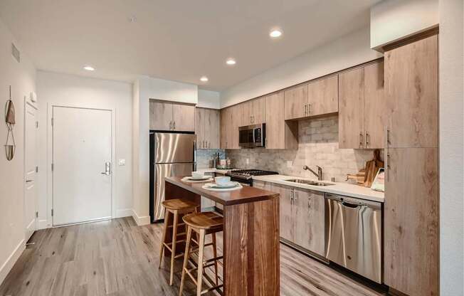 A kitchen with wooden cabinets and a white countertop.