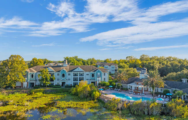 an aerial view of the resort with a swimming pool