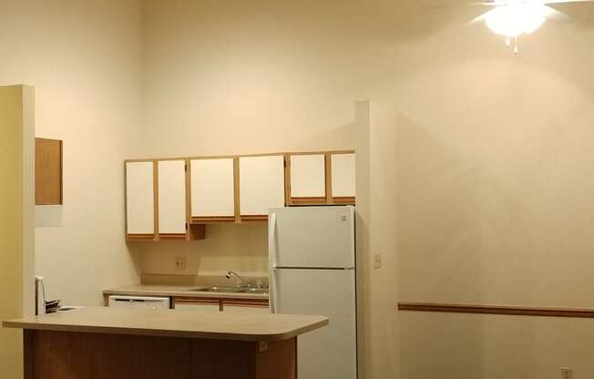 Image of kitchen with cabinets and appliances