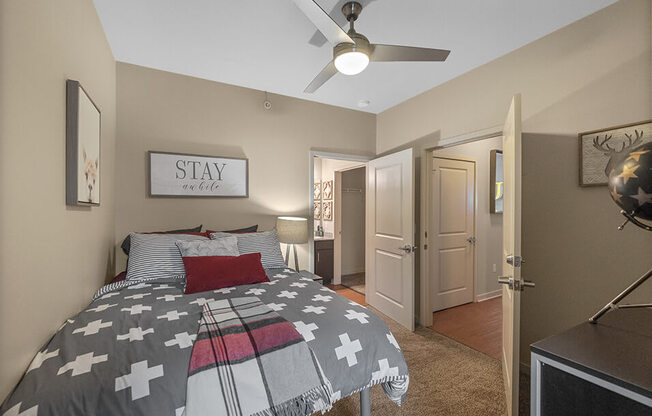 apartment bedroom and a ceiling fan