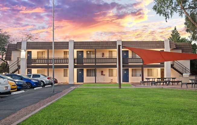 A building with a parking lot in front of it.