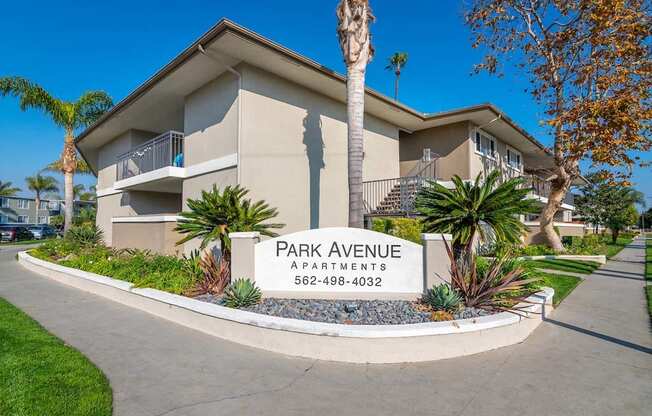 a building with a sign in front of it at Park Avenue Apartments, Long Beach