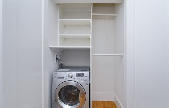 a small laundry room with a washer and dryer