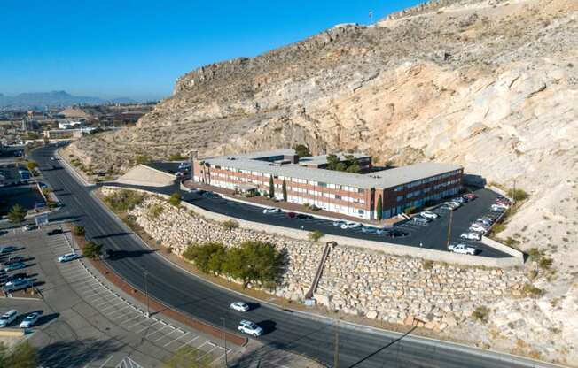 an aerial view of a building on the side of a mountain
