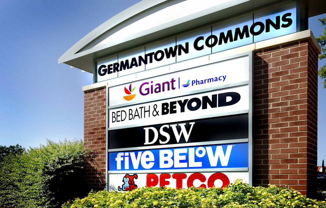 A sign for Germantown Commons with various businesses listed.