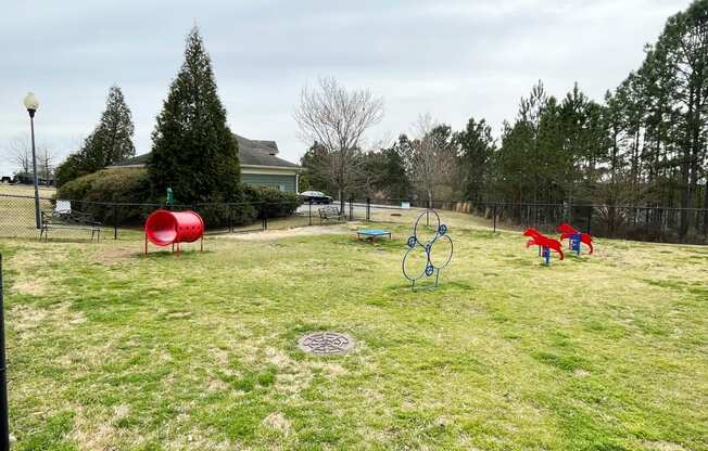 a park with playground equipment in a field