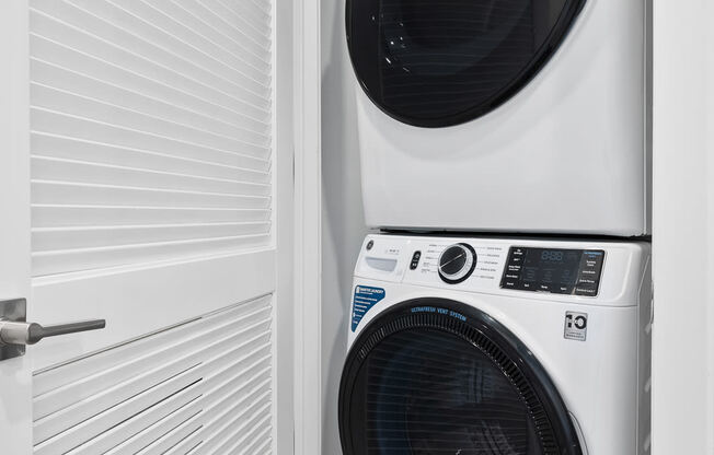 a white washer and dryer in a laundry room