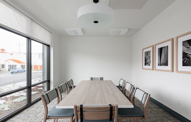 a conference room with a long wooden table and chairs at QUINN BY VINTAGE, Shoreline