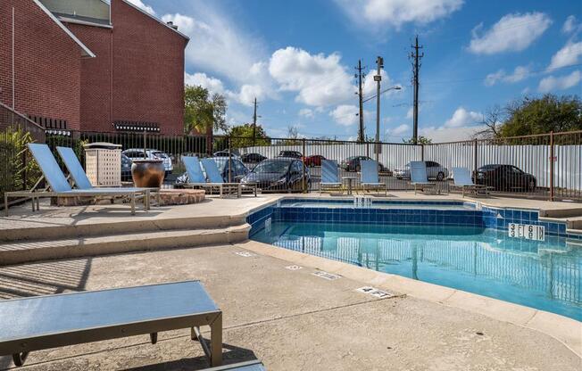 Pool Side Relaxing Area With Sundeck at Wildwood Apartments, CLEAR Property Management, Austin, TX, 78752