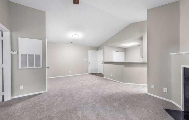 the living room and kitchen in a new home