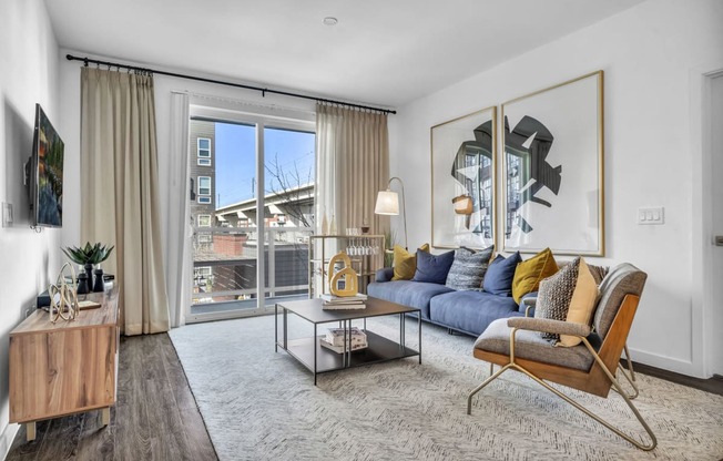 a living room with a couch and a sliding glass door