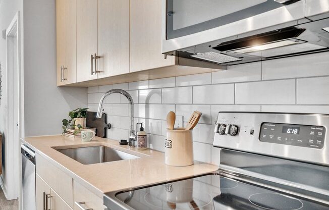 a kitchen with a sink and a stove