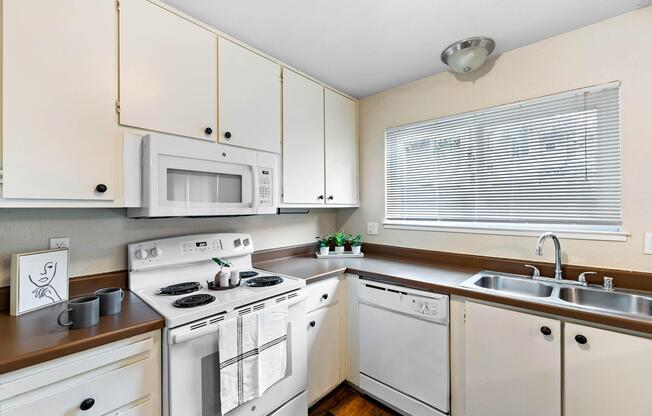 a kitchen with a stove and a sink