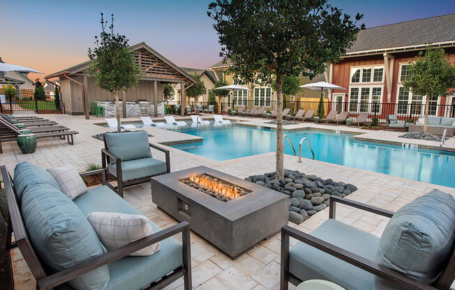 fire pit by the pool at the cottages