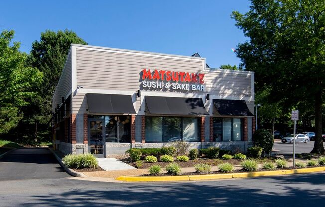 a restaurant with a sign on the side of a building