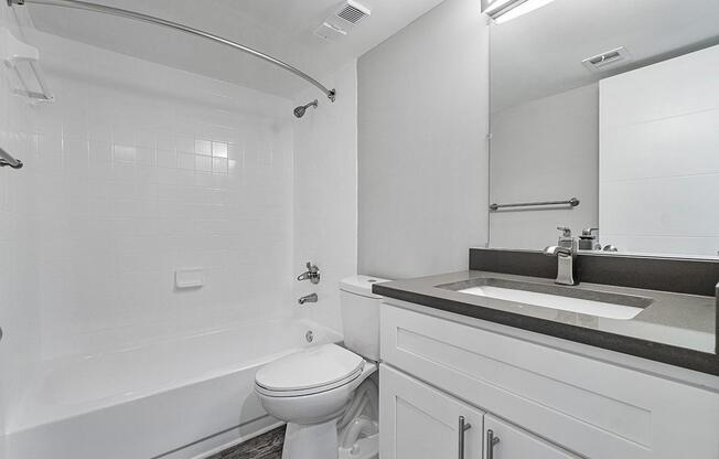 a white sink and a mirror
