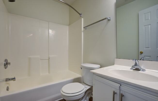 Bathroom with white shower and countertops