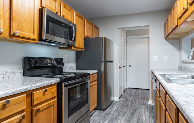 Lancaster Place Apartments in Calera Alabama photo of kitchen with stainless steel appliances