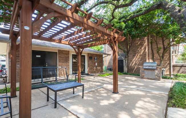 This is a photo of the BBQ area at Preston Park Apartments in Dallas, TX