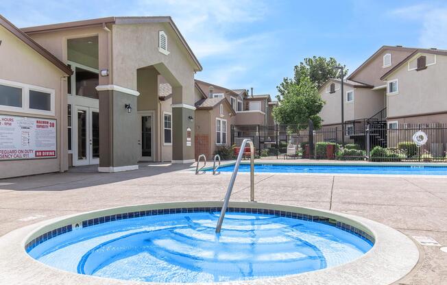 a pool of water in front of a house