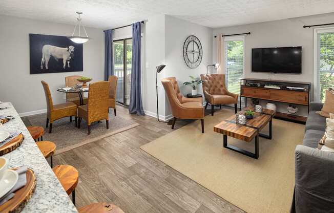 A living room with a grey couch and a wooden coffee table.