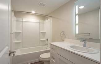 a bathroom with a sink toilet and bathtub