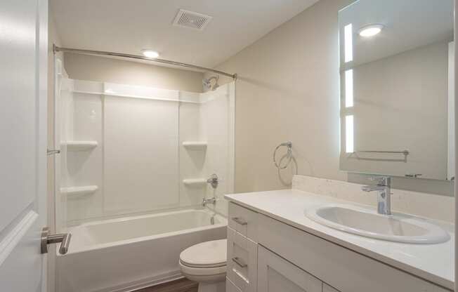 a bathroom with a sink toilet and bathtub