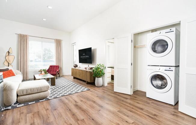 Enjoy the convenience of an in-home washer and dryer paired with spacious living areas, elevated ceilings, and wood-style flooring throughout.