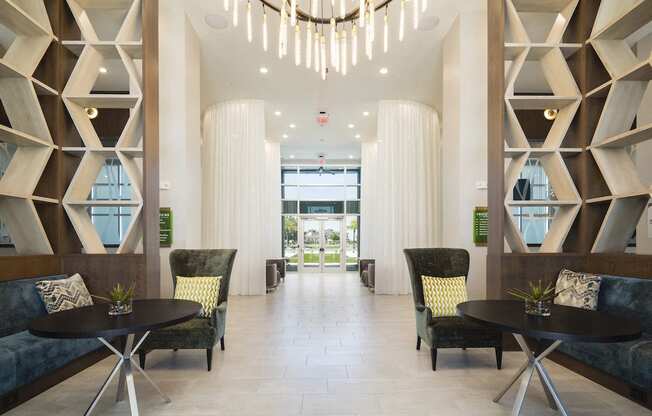 Lobby with private conversation nooks and luxury furnishings at Residences at The Green in Lakewood Ranch, FL