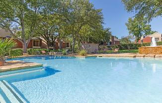 Palisades at Bear Creek community pool with green trees