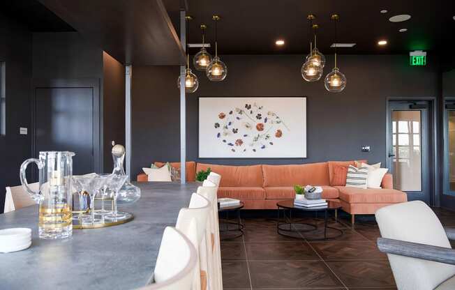 Modern bar-style seating area with comfy sofa and delicate lighting at Novel Cary