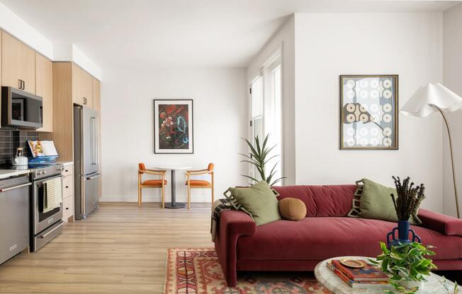 Open-concept living with light wood cabinetry, stainless steel appliances, and space to dine, unwind, and entertain with ease.