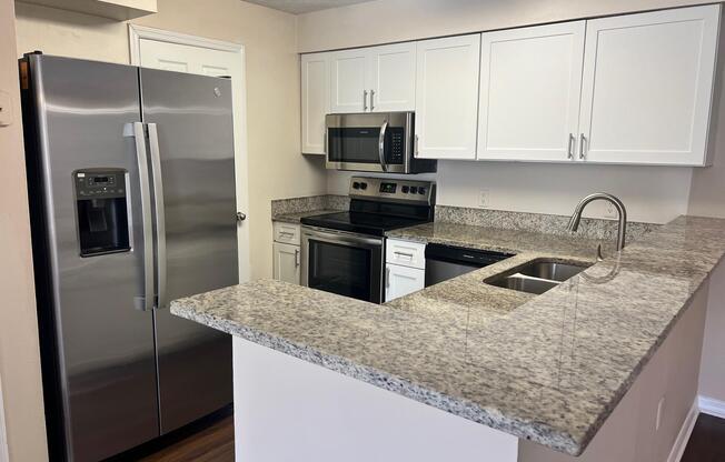 a modern kitchen with stainless steel appliances