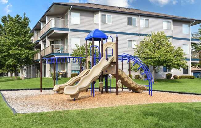 Blue and tan playground at Shoreline Village Apartments in Richland, WA.