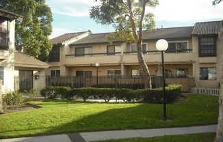 Charming Gated 2 bedroom and 1.5 Bath Condo with a Two-Car Garage
