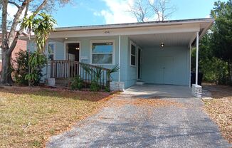 Wow,  2/1 with carport near 49th St - nice yard, too!