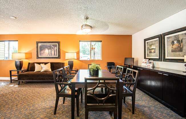 a dining room with a table and chairs at Eagles Landing Apartments, Everett, 98204