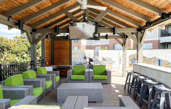 a patio with chairs and tables and a bar