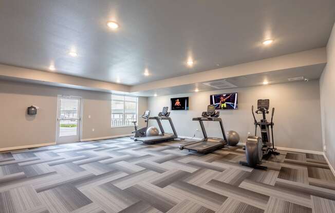the retreat at thousand oaks fitness room with weights and cardio equipment
