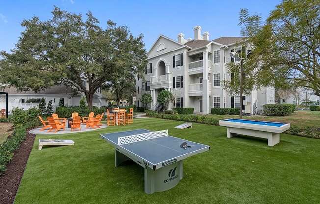 Outdoor amenity area with Ping Pong, Pool table, fire pit and seating