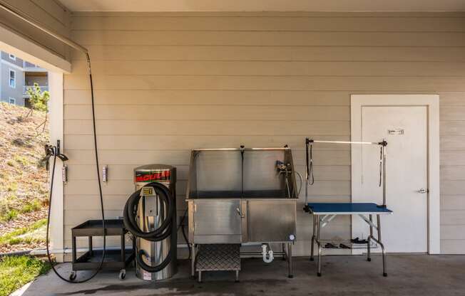 the outside of a house with two stainless steel tanks and a gas hose at Village at Westland Cove Apartments, Tennessee, 37922