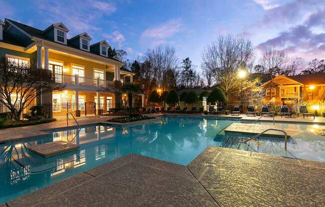 A large house with a pool in the backyard.