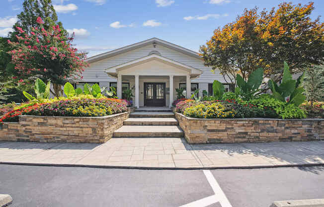 A house with a front yard and a driveway.