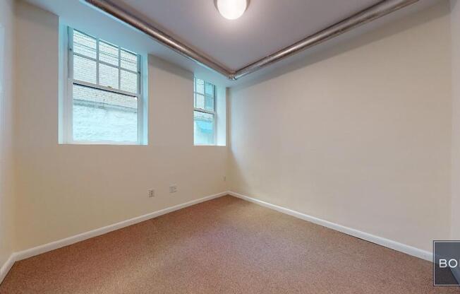 207 209 W 11 ST