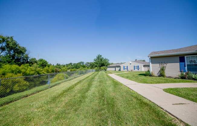 green space with grass in apartment community