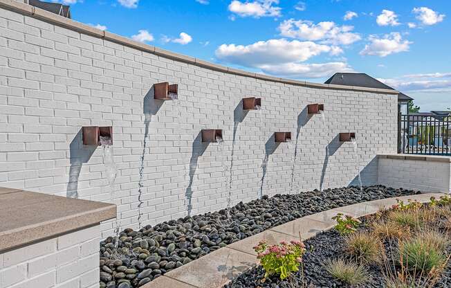 Wall fountain next to pool